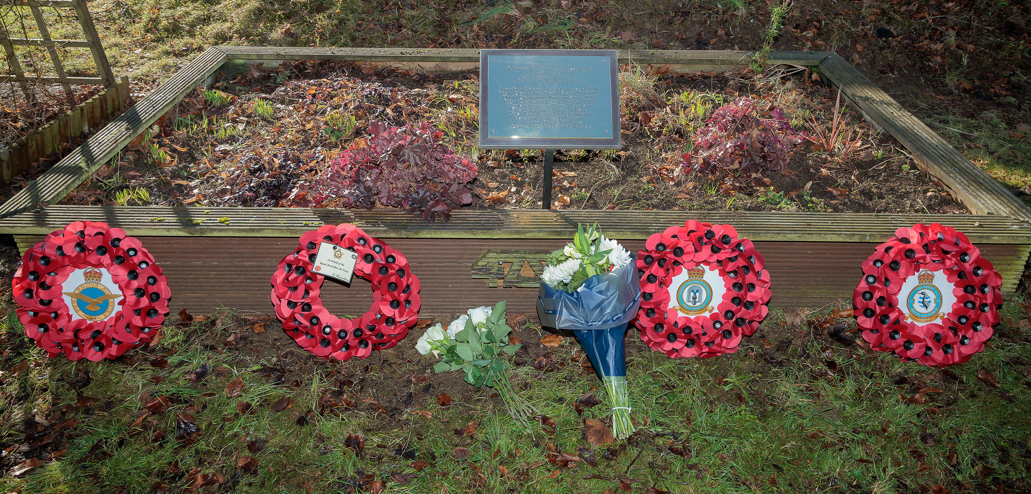 Photo depicting the wreaths laid at the memorial for the crew and passengers of RAF C-130K Hercules XV179.